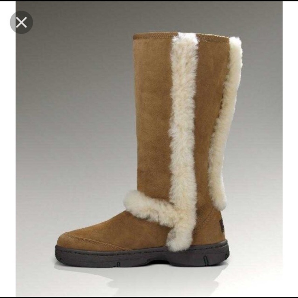 Ugg sunburst boots. Open box. Small rip repaired